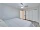 Primary bedroom with king-size bed and access to walk-in closet at 5206 Whispering Leaf Trl, Valrico, FL 33596