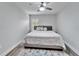 Large bedroom with king-size bed and gray walls at 5206 Whispering Leaf Trl, Valrico, FL 33596