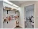Organized closet with shelves for storage and a mirror at 5206 Whispering Leaf Trl, Valrico, FL 33596