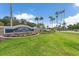 Twin Lakes of Brandon community entrance with lush landscaping at 5206 Whispering Leaf Trl, Valrico, FL 33596