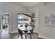 Bright dining area with a view of the pool and patio at 5206 Whispering Leaf Trl, Valrico, FL 33596