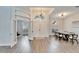 Elegant dining room with hardwood floors and modern chandelier at 5206 Whispering Leaf Trl, Valrico, FL 33596