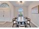 Elegant dining room with a dark wood table and six chairs at 5206 Whispering Leaf Trl, Valrico, FL 33596