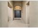 Front entry with double doors and arched window at 5206 Whispering Leaf Trl, Valrico, FL 33596