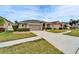 One-story home with attached garage and manicured lawn at 5206 Whispering Leaf Trl, Valrico, FL 33596