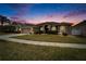 Home exterior at dusk at 5206 Whispering Leaf Trl, Valrico, FL 33596