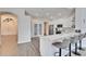 Modern kitchen with white cabinets, quartz countertops, and breakfast bar at 5206 Whispering Leaf Trl, Valrico, FL 33596