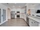 Modern kitchen with stainless steel appliances and white cabinetry at 5206 Whispering Leaf Trl, Valrico, FL 33596