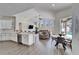 Open-concept kitchen and living area with modern appliances at 5206 Whispering Leaf Trl, Valrico, FL 33596