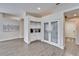 Kitchen with white cabinets and unique pantry doors at 5206 Whispering Leaf Trl, Valrico, FL 33596