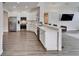 Modern kitchen with stainless steel appliances and white cabinetry at 5206 Whispering Leaf Trl, Valrico, FL 33596