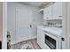 Laundry room with washer, dryer, and built-in cabinets at 5206 Whispering Leaf Trl, Valrico, FL 33596