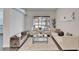 Living room with pool view, comfy seating, and stylish decor at 5206 Whispering Leaf Trl, Valrico, FL 33596