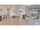 Bright living room with pool view, plush sofas, and large windows at 5206 Whispering Leaf Trl, Valrico, FL 33596