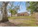 Spacious backyard with shed and large tree, offering ample space at 5332 Nutcracker Cir, Land O Lakes, FL 34639