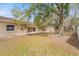 Backyard view of house and storage shed at 5332 Nutcracker Cir, Land O Lakes, FL 34639