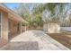 Large paved patio, perfect for outdoor entertaining, with shed and fenced yard at 5332 Nutcracker Cir, Land O Lakes, FL 34639