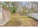 Fenced backyard with shed and trees at 5332 Nutcracker Cir, Land O Lakes, FL 34639