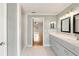 Modern bathroom with double vanity and access to other rooms at 5332 Nutcracker Cir, Land O Lakes, FL 34639