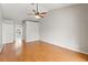 Spacious bedroom with hardwood floors and ceiling fan at 5332 Nutcracker Cir, Land O Lakes, FL 34639