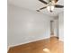 Simple bedroom with hardwood floors and ceiling fan at 5332 Nutcracker Cir, Land O Lakes, FL 34639
