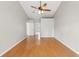Large bedroom with hardwood floors and ceiling fan at 5332 Nutcracker Cir, Land O Lakes, FL 34639