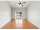 Bedroom with hardwood floors and sliding glass doors at 5332 Nutcracker Cir, Land O Lakes, FL 34639