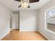 Bright bedroom with wood floors and large window at 5332 Nutcracker Cir, Land O Lakes, FL 34639