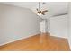 Primary bedroom with hardwood floors and ceiling fan at 5332 Nutcracker Cir, Land O Lakes, FL 34639