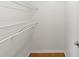 White closet with wire shelving and wooden floor at 5332 Nutcracker Cir, Land O Lakes, FL 34639