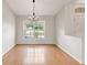 Spacious dining area with hardwood floors and large window at 5332 Nutcracker Cir, Land O Lakes, FL 34639