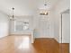 Light and airy entryway with hardwood floors and white door at 5332 Nutcracker Cir, Land O Lakes, FL 34639