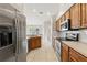 Kitchen with stainless steel appliances and wood cabinets at 5332 Nutcracker Cir, Land O Lakes, FL 34639