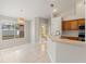 Kitchen with wood cabinets, stainless steel appliances, and tile floor at 5332 Nutcracker Cir, Land O Lakes, FL 34639