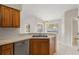 Kitchen with wood cabinets, tile floor and island at 5332 Nutcracker Cir, Land O Lakes, FL 34639