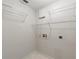 Laundry room with wire shelving and white walls at 5332 Nutcracker Cir, Land O Lakes, FL 34639