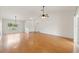Living room with hardwood floors, high ceilings, and a view to the backyard at 5332 Nutcracker Cir, Land O Lakes, FL 34639