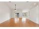 Spacious living room with hardwood floors and sliding glass doors at 5332 Nutcracker Cir, Land O Lakes, FL 34639
