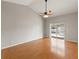 Bright living room with hardwood floors and sliding glass doors at 5332 Nutcracker Cir, Land O Lakes, FL 34639