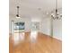 Bright living room with hardwood floors and sliding glass doors leading to backyard at 5332 Nutcracker Cir, Land O Lakes, FL 34639