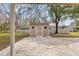Tan storage shed with ramp access at 5332 Nutcracker Cir, Land O Lakes, FL 34639