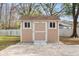 Tan storage shed with double doors at 5332 Nutcracker Cir, Land O Lakes, FL 34639