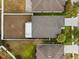 Aerial view of a house and backyard with fire pit at 5809 War Admiral Dr, Wesley Chapel, FL 33544