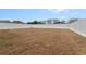 Large backyard with grassy lawn and fire pit at 5809 War Admiral Dr, Wesley Chapel, FL 33544