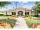 Community clubhouse with landscaped grounds at 5809 War Admiral Dr, Wesley Chapel, FL 33544