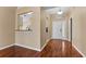 Hardwood floor in the entrance hall looking toward the kitchen at 5809 War Admiral Dr, Wesley Chapel, FL 33544