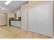 Open kitchen with white cabinets, tile floors and stainless steel appliances at 5809 War Admiral Dr, Wesley Chapel, FL 33544