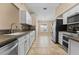 Modern kitchen with stainless steel appliances and white cabinets at 5809 War Admiral Dr, Wesley Chapel, FL 33544