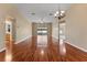Spacious living room featuring hardwood floors and sliding glass doors to patio at 5809 War Admiral Dr, Wesley Chapel, FL 33544