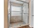 Large walk-in shower with tile surround and glass enclosure at 5809 War Admiral Dr, Wesley Chapel, FL 33544